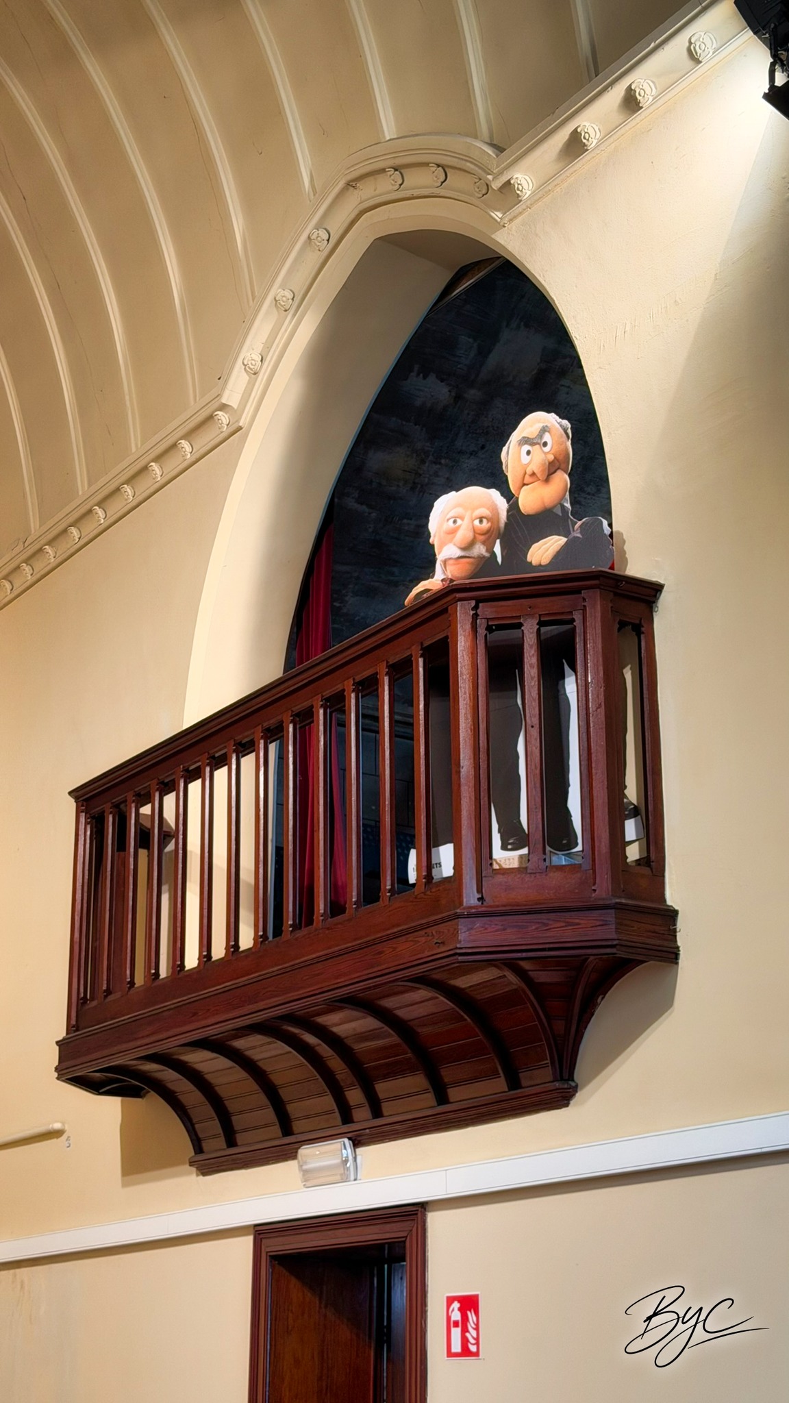 Two humorous characters installed in the former pulpit of The Temple
